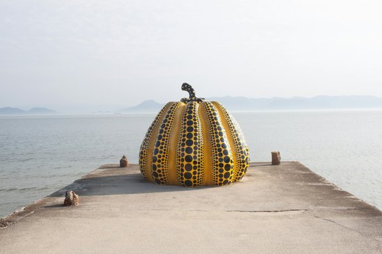 Yayoi Kusama's yellow pumpkin sculpture on the shore of Naoshima